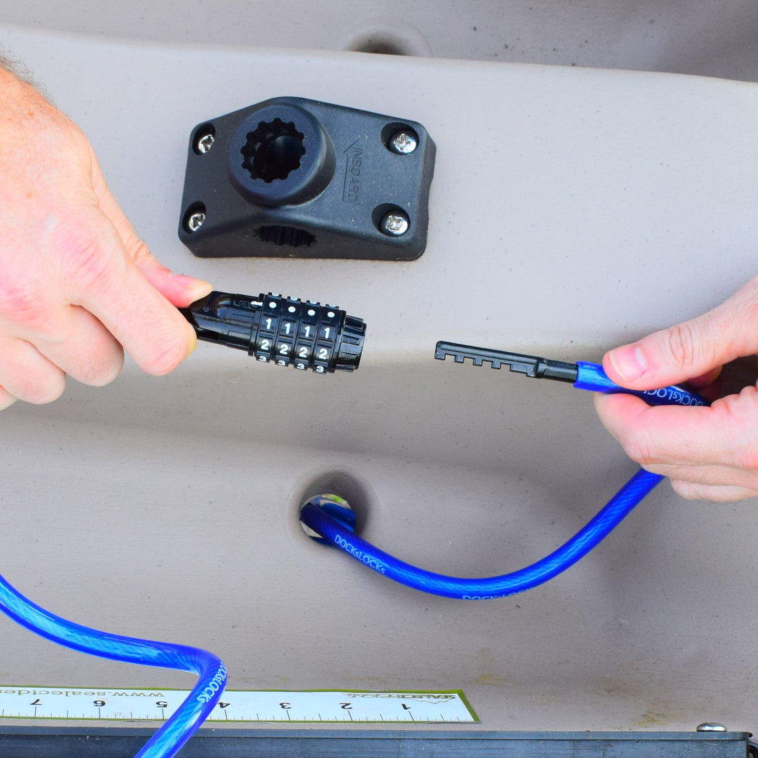 DocksLocks straight combo cable lock securing a kayak overnight at camp